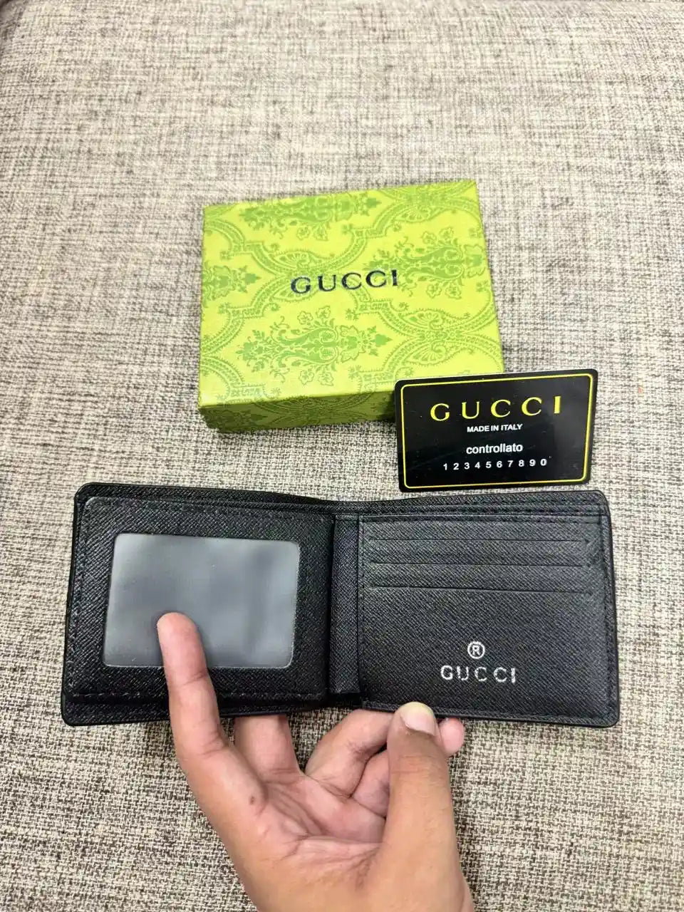 GG Embossed Textured Leather Bifold Wallet - GUCCI